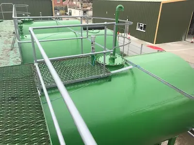 Spray coat system long term protection for storage tank exteriors
