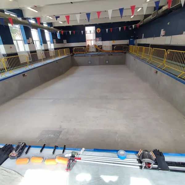 Existing bag liner removed and pool shell diamond grinded