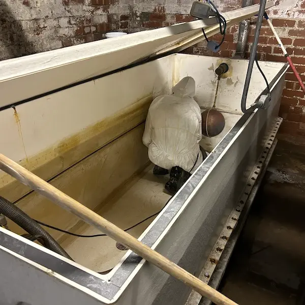 Power sanding tank prior to flex lining