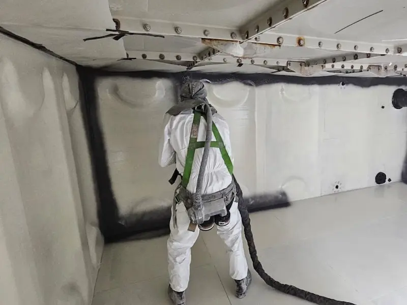 Spraying Polyurea to swimming pool make up tank