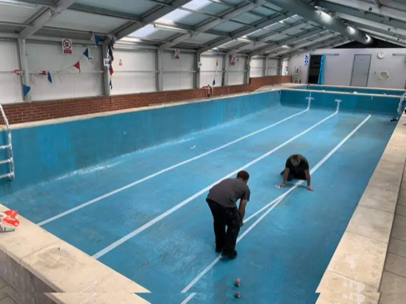 Apply demarcation for the lane lines prior to top coating