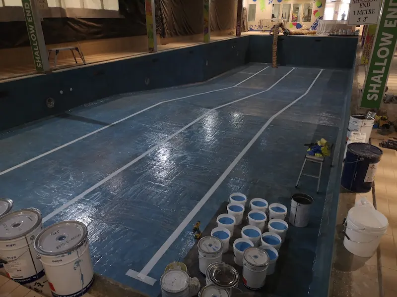 Marking out the lane lines prior to applying the blue flowcoat
