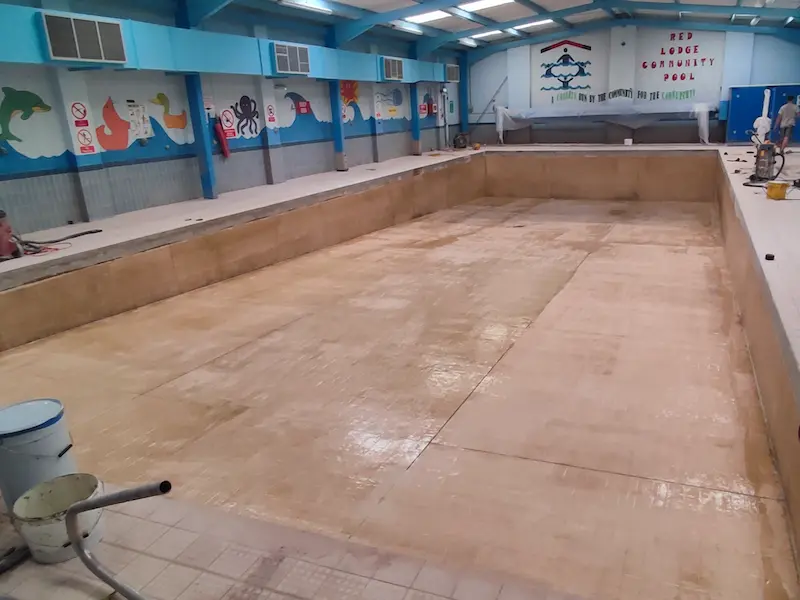 Prepared Tiles Primed in Vinyl Ester ready for the installation of the Fibreglass Laminate