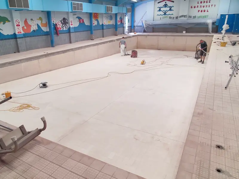 Tiles grinded to promote adhesion